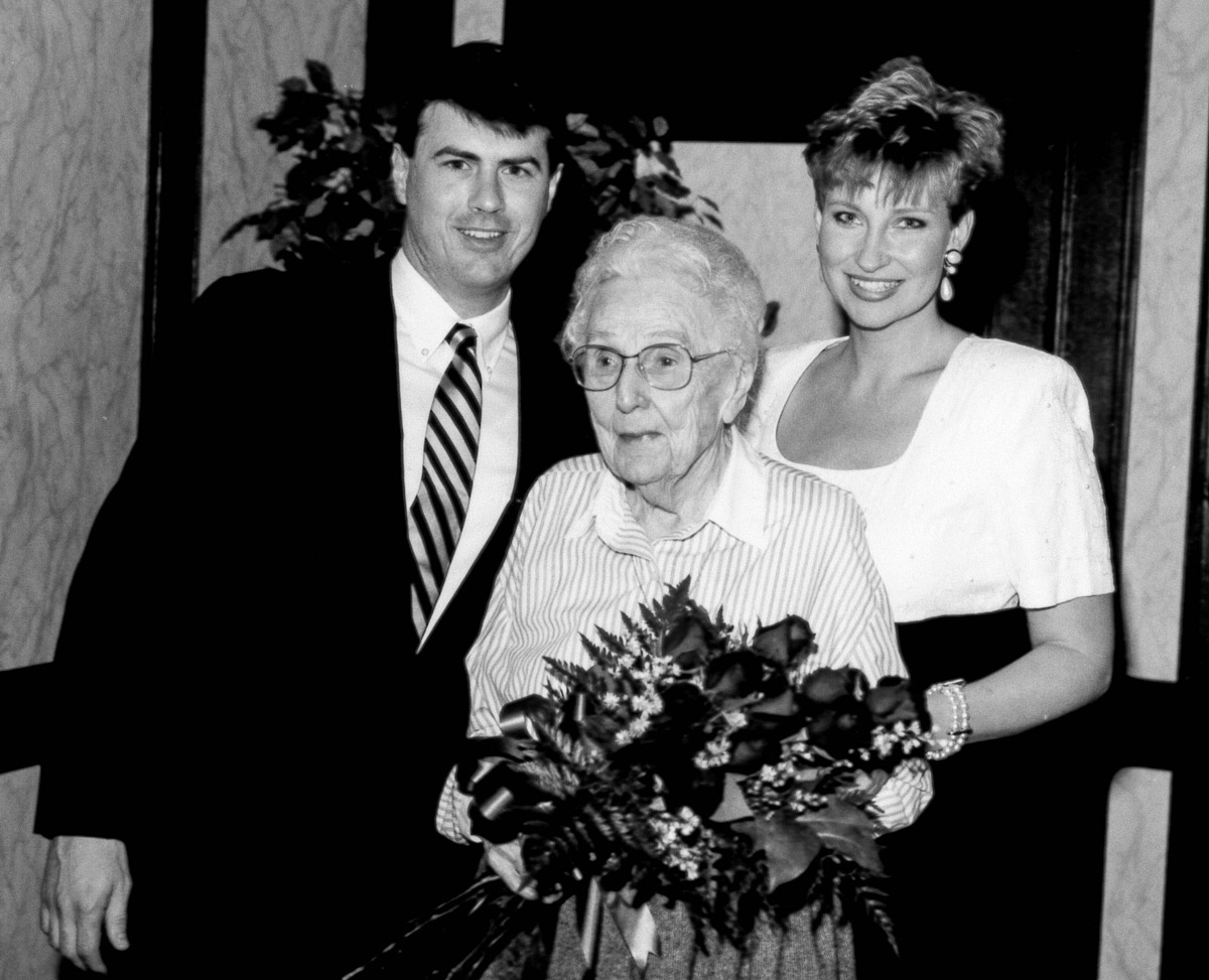Home Instead founders Paul and Lori Hogan with Eleanor Manhart