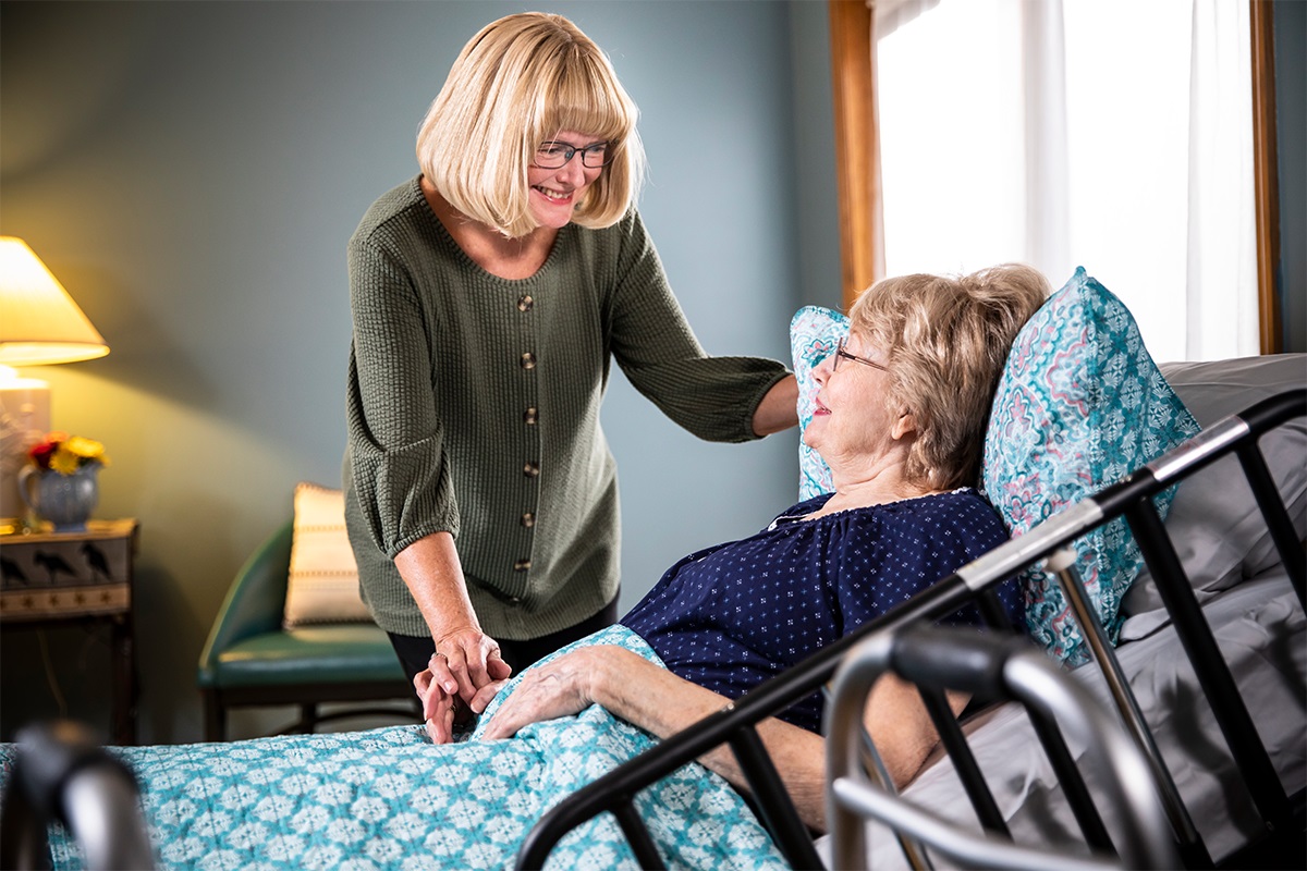 Sick senior and caregiver