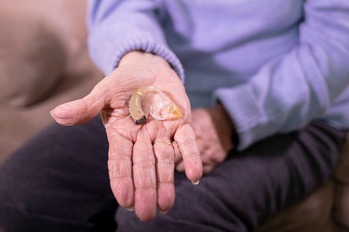 hearing aid placed in hand