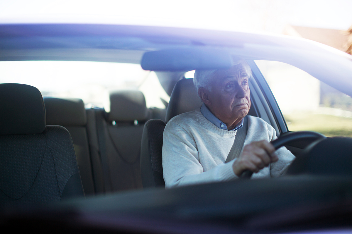 senior man in a car