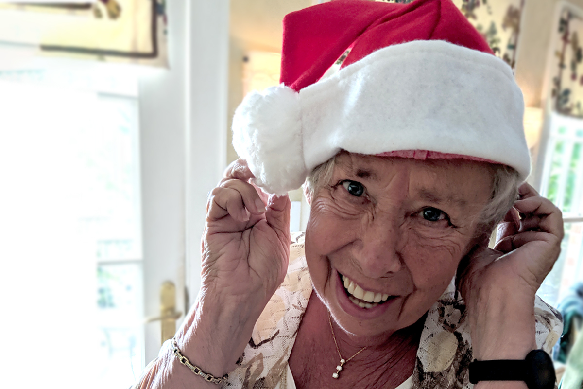 Senior in a santa hat