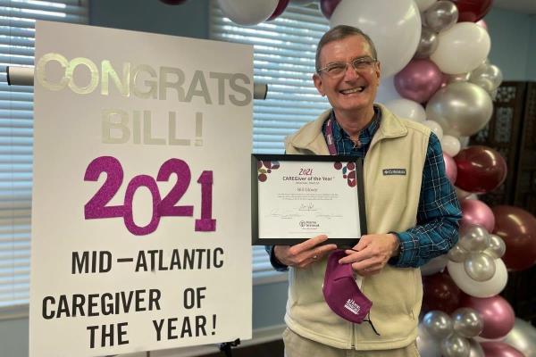 Home Instead Caregiver Bill Glover receives the 2021 Mid-Atlantic Caregiver of the Year award.