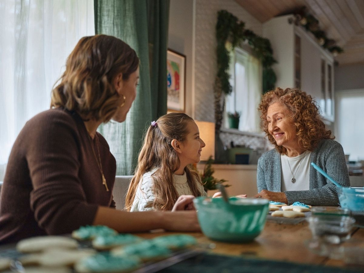Grandparent with dementia sharing a joyful moment with grandchild – intergenerational connection and caregiving support.
