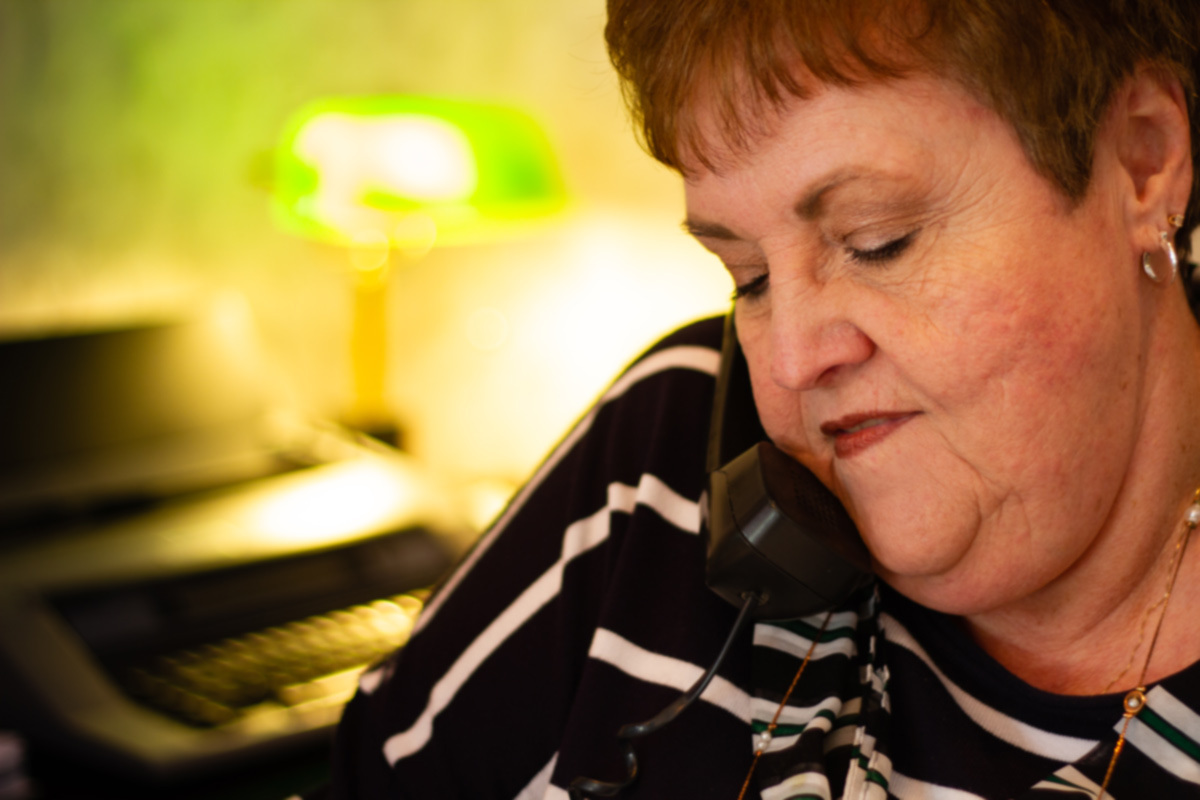 Woman caregiver on the phone discussing senior care options